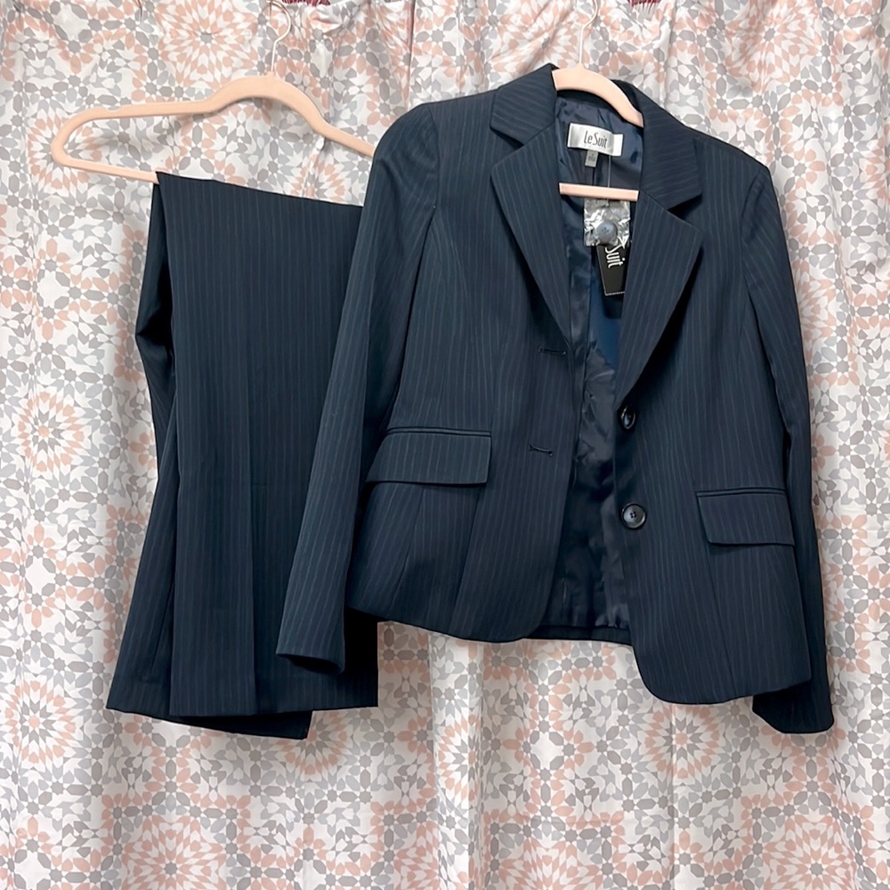 Navy pinstripe beautiful suit, size 4. Still has the tag.